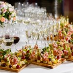 the buffet at the reception. Assortment of canapes. Banquet service. catering food, snacks with cheese, jamon, prosciutto and fruit