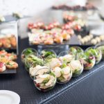 Beautifully decorated catering banquet table with different food snacks and appetizers